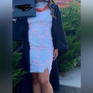 White dress with pink floral detailing